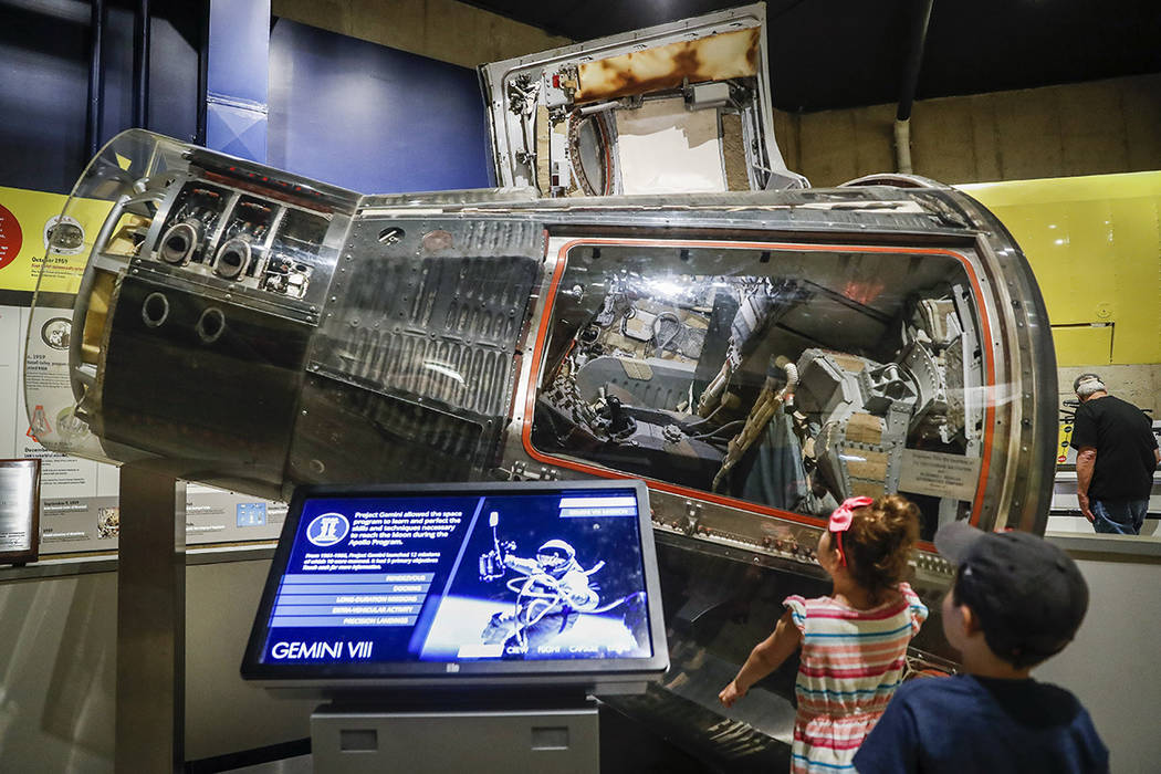 Visitors look on the Gemini VIII spaceship at the Armstrong Air & Space Museum, Wednesday, ...