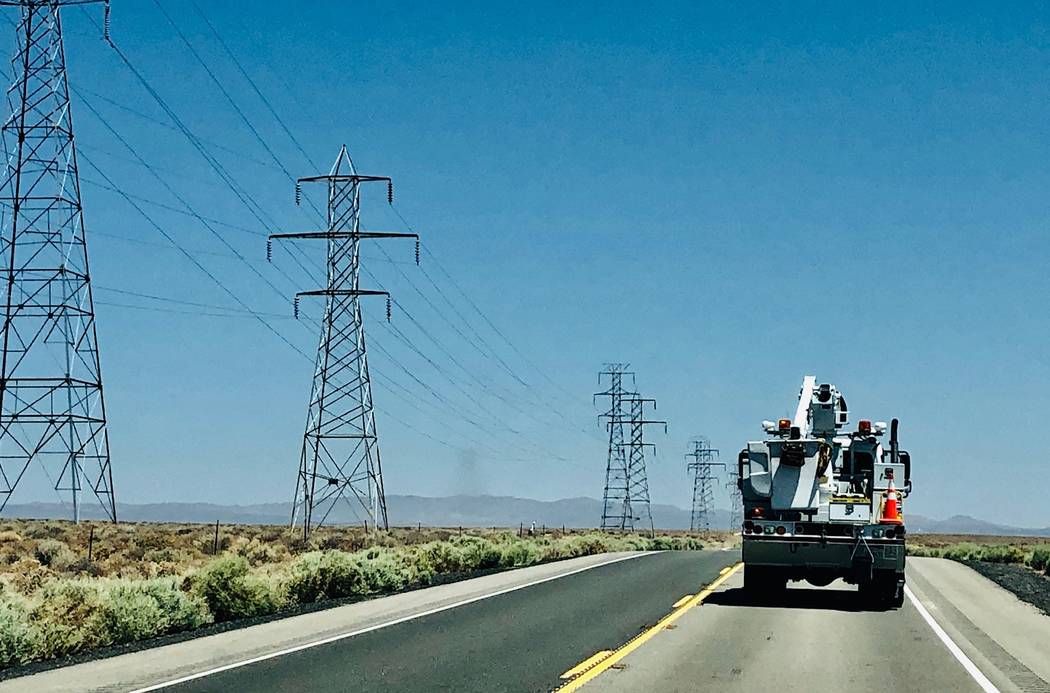 A utility repair vehicle makes its way up Highway 395 to Ridgecrest, Calif., Saturday, July 6, ...