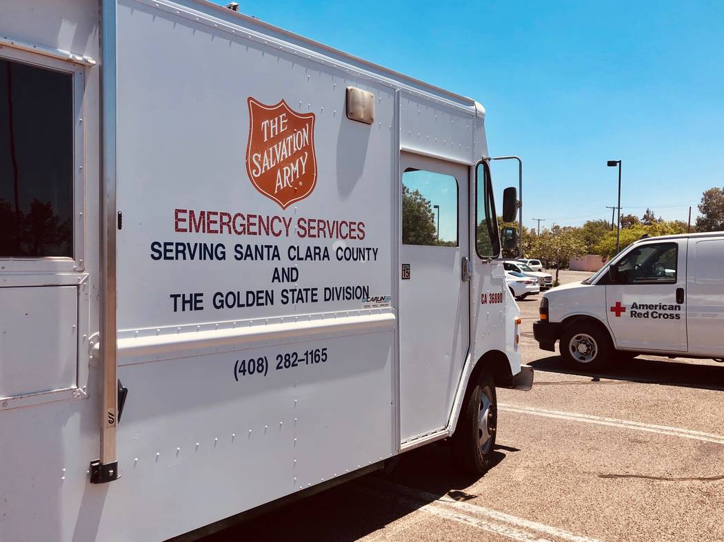 Emergency service vehicles in the parking lot of Freedom Park near the Ridgecrest City Hall in ...