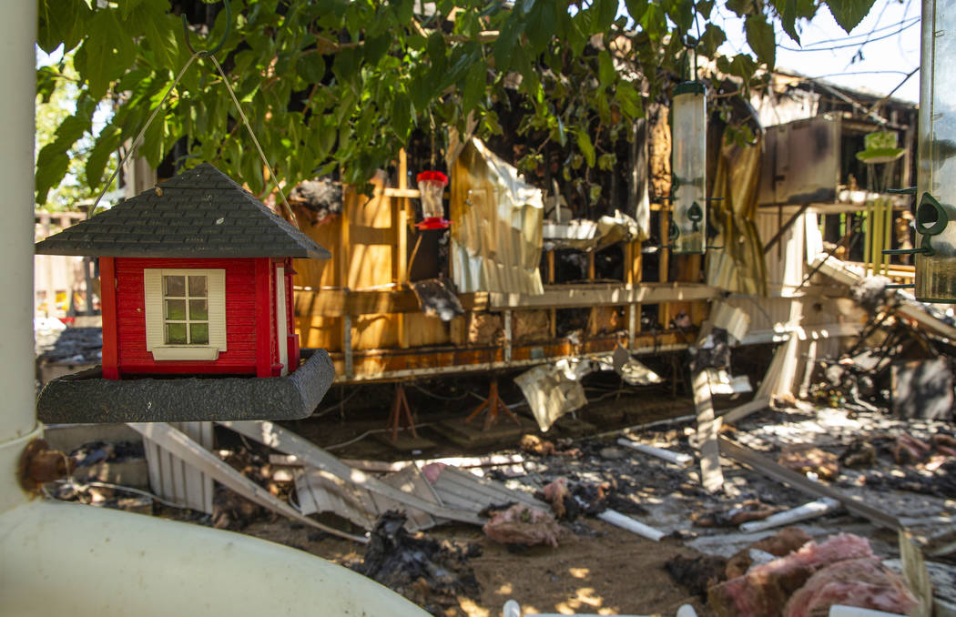 A birdhouse is one of few things remaining after a fire at the Town and Country Mobile Home Par ...