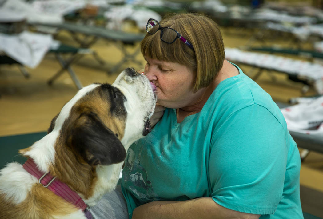 April Hamlin gets kisses from her dog Duchess some crackers while staying at the California Ear ...