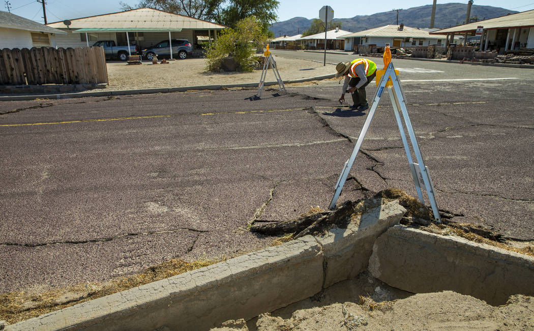 Scientists working along side the USGS measure and monitor the extensive cracks with shifting p ...