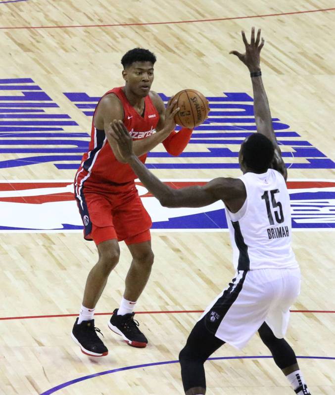 The Washington Wizards' forward Rui Hachimura (8) prepares to shoot to the basket as the Brookl ...