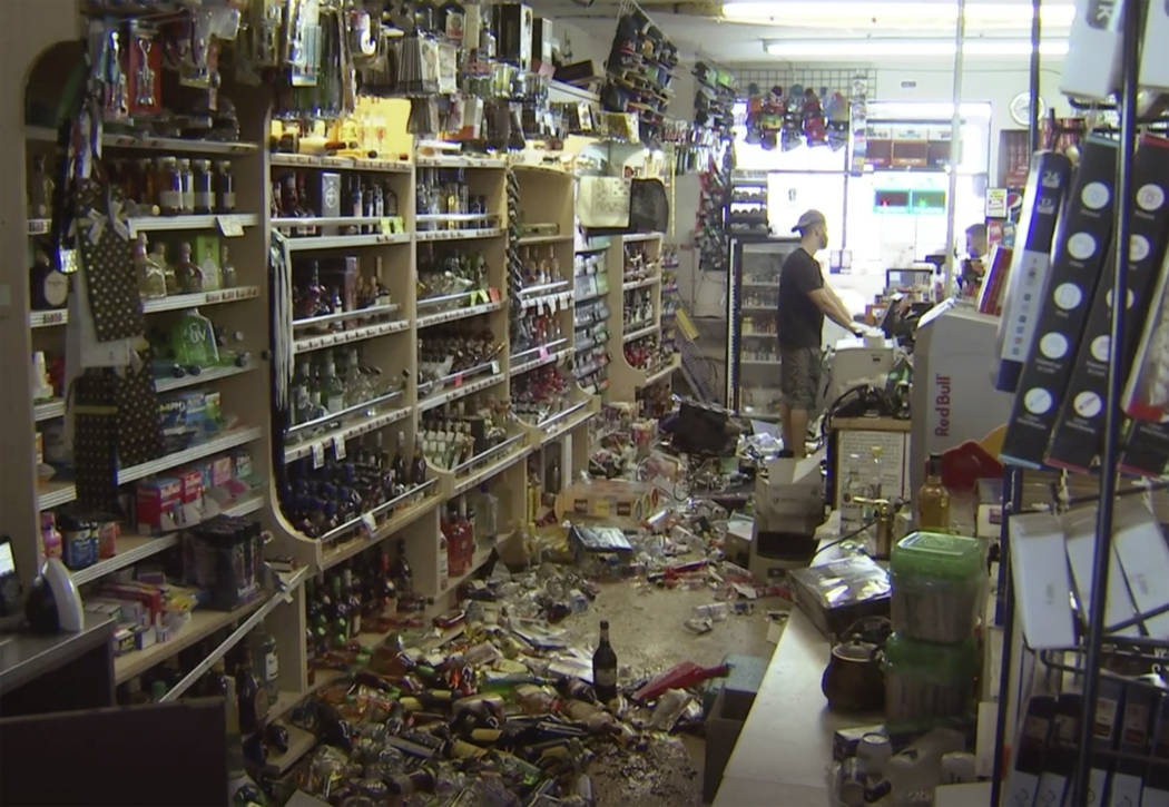 This still image taken from video shows bottles and debris on the floor of a liquor store as a ...