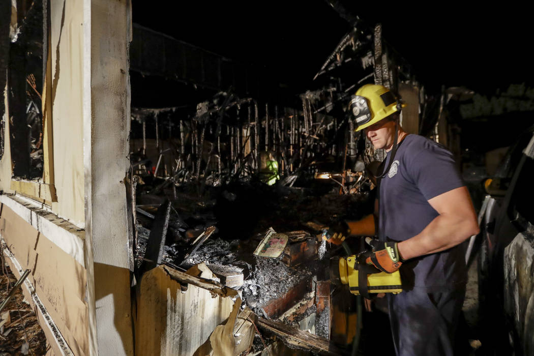 A fireman looks over a home Saturday, July 6, 2019 that burned after a earthquake in Ridgecrest ...