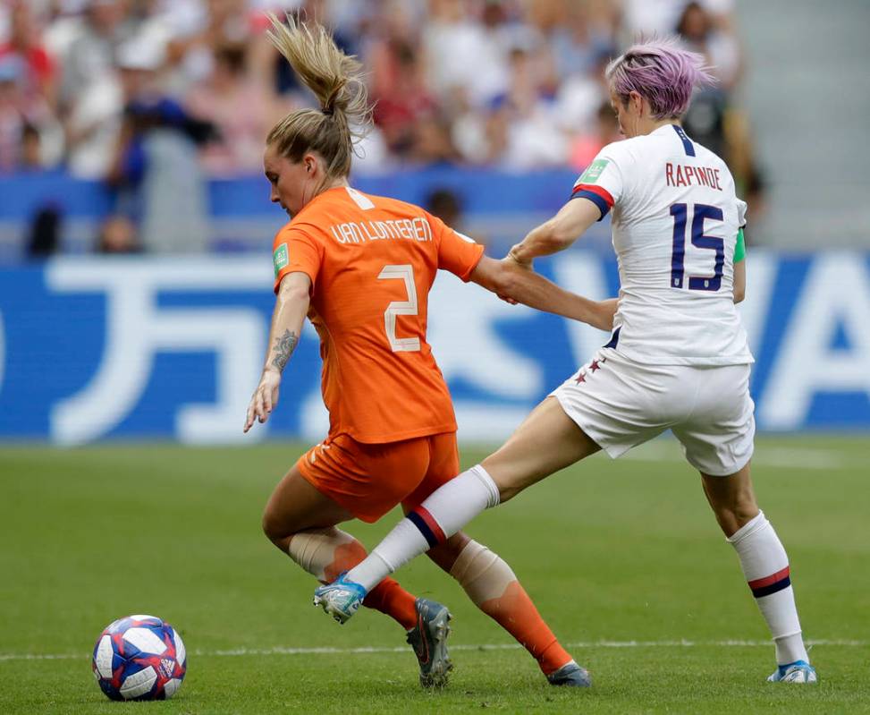 United States' Megan Rapinoe, right, challenges Netherlands' Desiree Van Lunteren, left, during ...