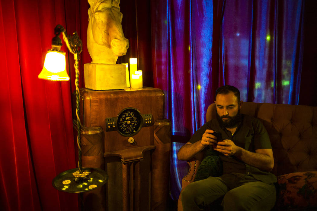 Myron Hensel, of Las Vegas, sits in the White Rabbit speakeasy saloon during the Jack Daniel's ...