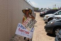 A grandmother protesting the treatment of children in Border Patrol custody walks back to her c ...