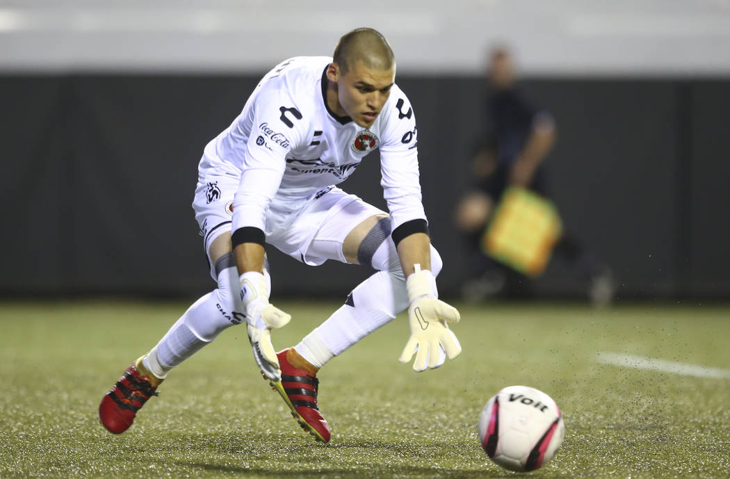 Tijuana's Gibran Lajud (25) reaches to block during an exhibition soccer match against Leon at ...