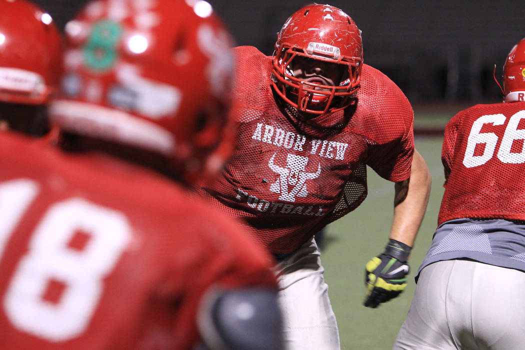 Arbor View tackle Malik Noshi runs a play on defense during practice Wednesday, Nov. 19, 2014. ...