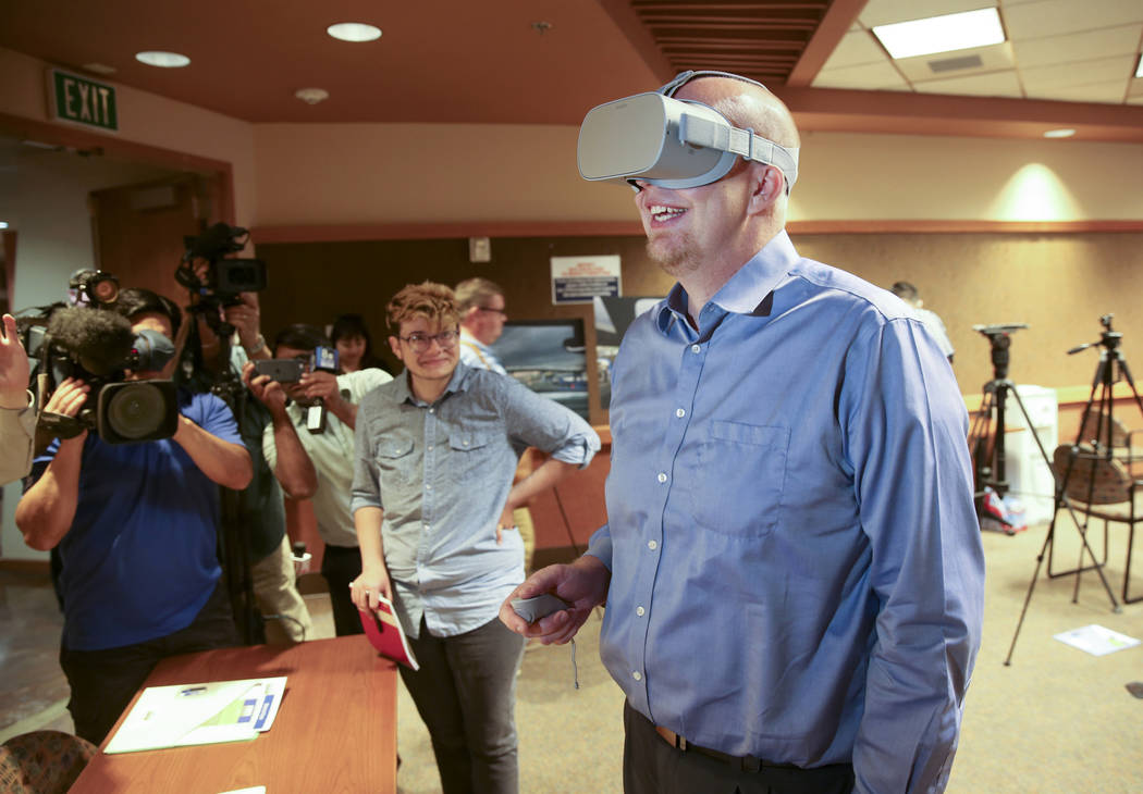 Mike Warnick, a senior engineer with Atkins design, engineering and project management, checks ...