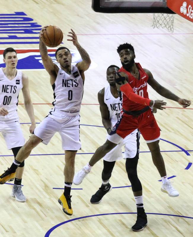 The Brooklyn Nets' guard Josh Gray (0) goes to the basket as the Washington Wizards' guard Core ...