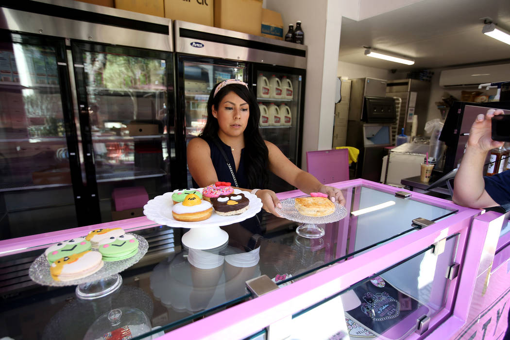 Hello Kitty Cafe Business Development Coordinator Melissa Paez prepares for a media preview for ...