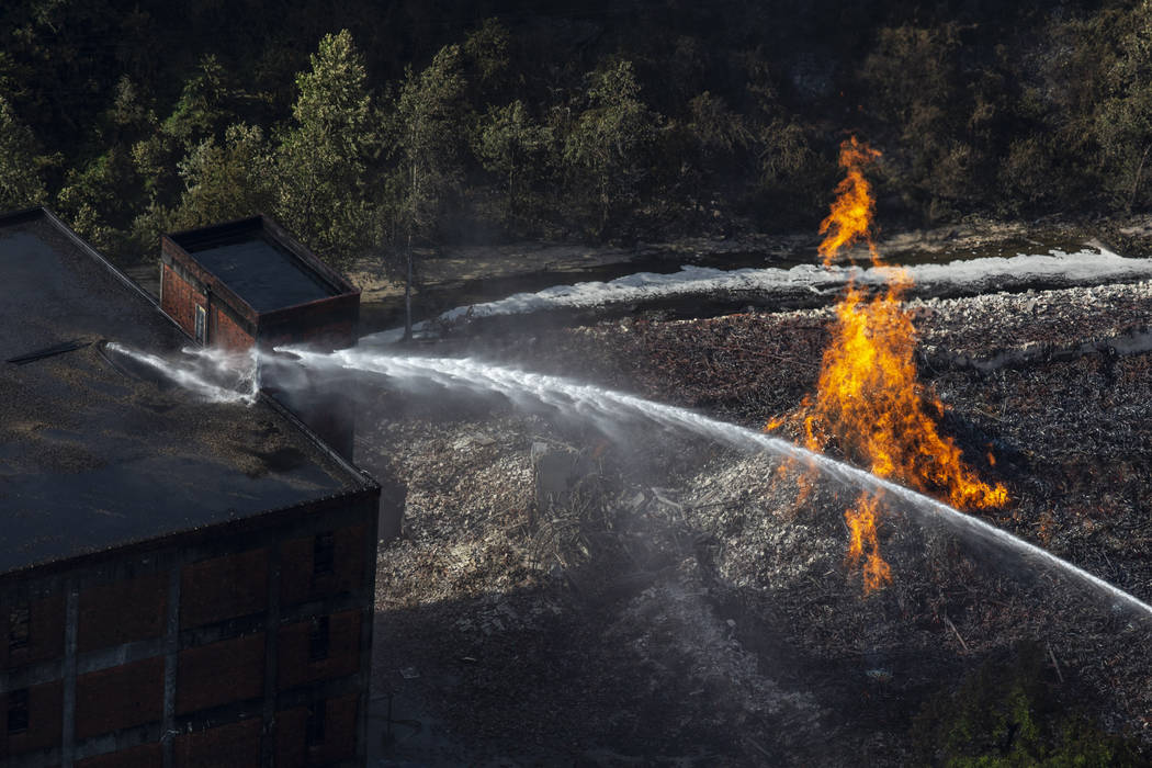 Flames and smoke rise from a bourbon warehouse fire at a Jim Beam distillery in Woodford Count ...