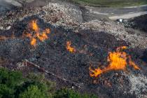 Flames and smoke rise from a bourbon warehouse fire at a Jim Beam distillery in Woodford County ...