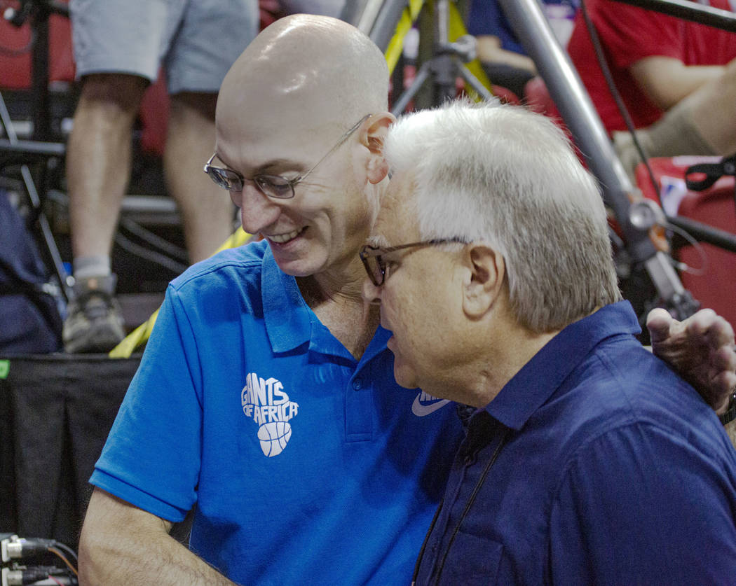 NBA Commissioner Adam Silver talks to Warren LeGarie, Summer League executive director, during ...