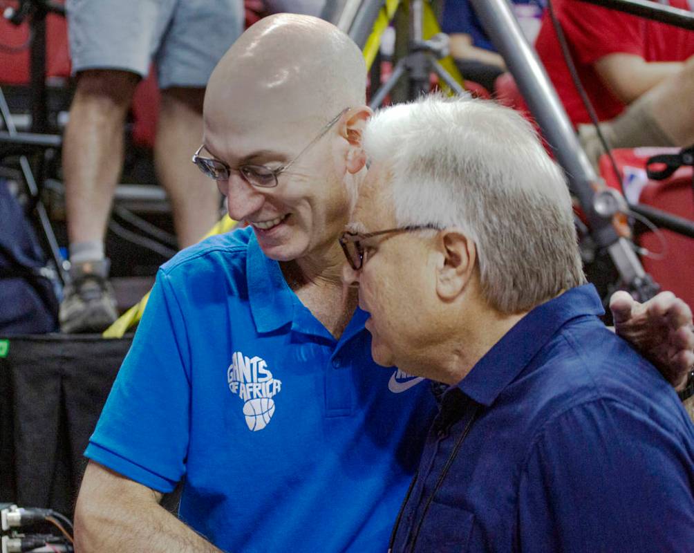 NBA Commissioner Adam Silver talks to Warren LeGarie, Summer League executive director, during ...