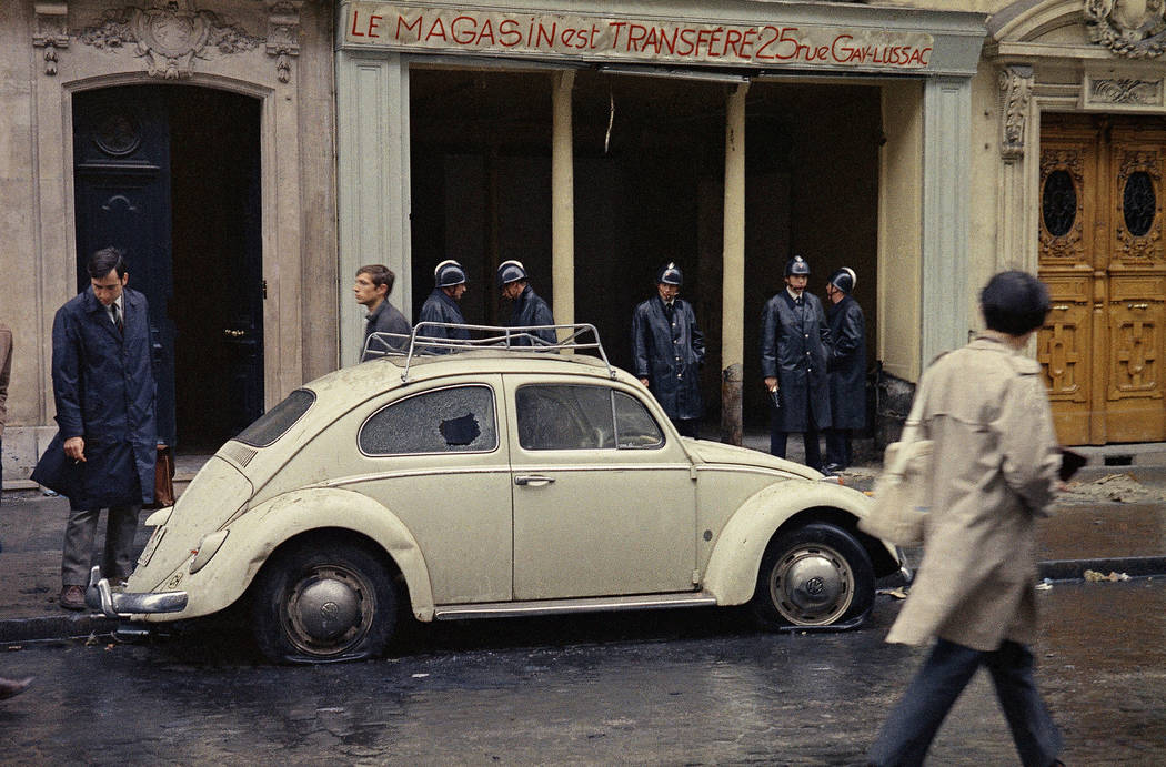 FILE - In this May 11, 1968 file photo, Guards stand in front of a shop on a street in the Lati ...