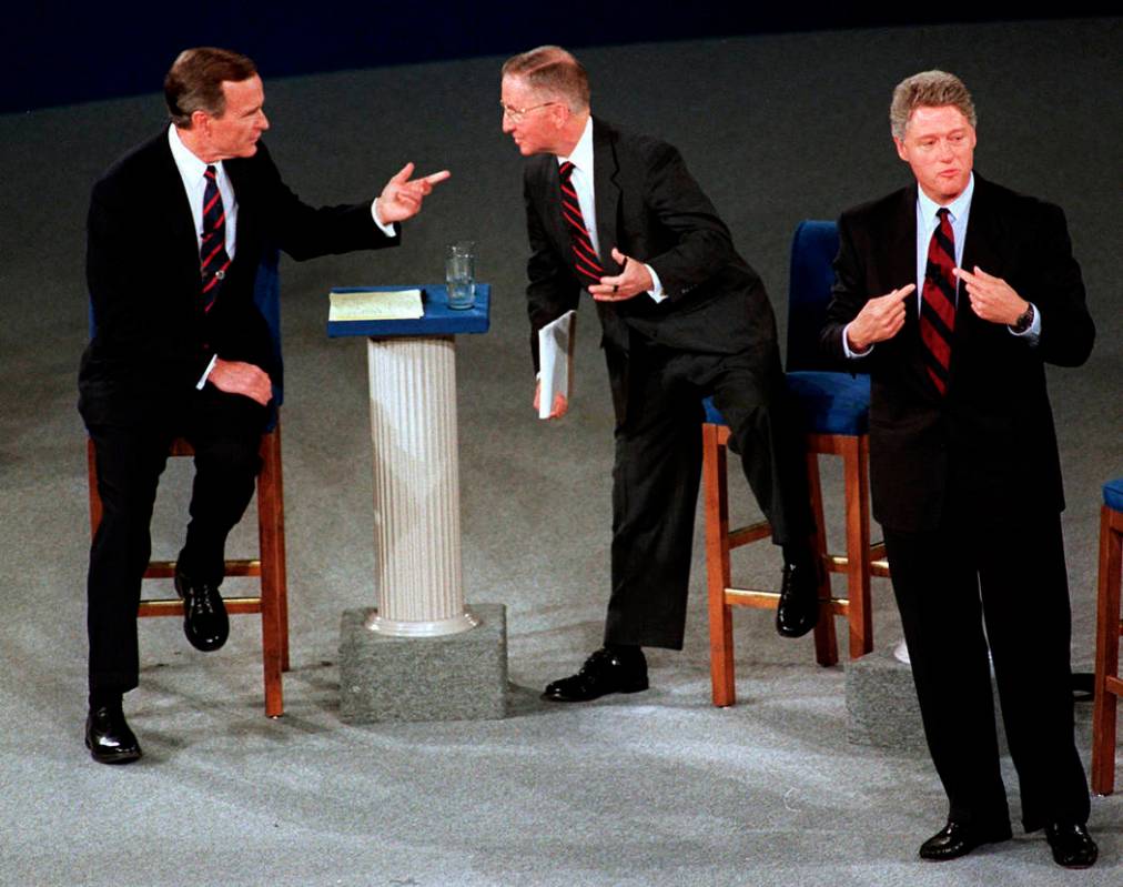 President George H.W. Bush, left, talks with independent candidate Ross Perot as Democratic can ...