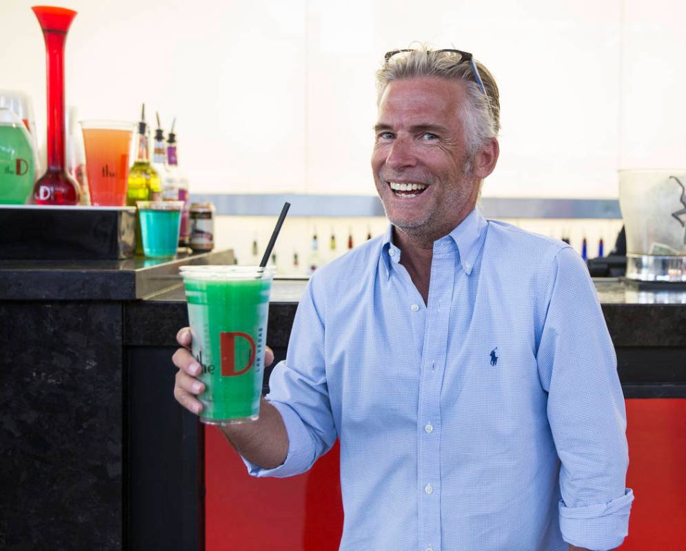 Jason Frankel holds a freshly poured 32-ounce frozen margarita on Friday, July 5, 2019, at the ...