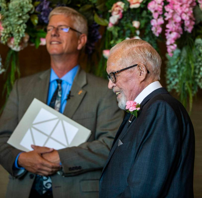 Deacon Tim O'Callaghan, left, and Gail Andress wait for Donna Andress to come down the aisle du ...