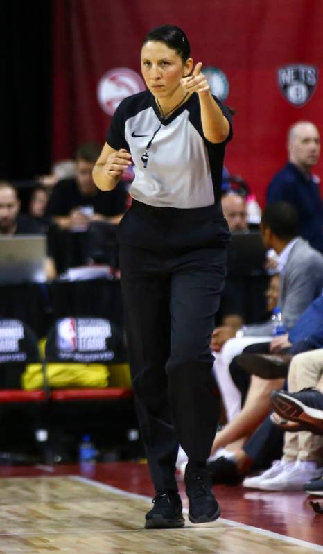 Referee Hortencia Sanchez-Carrizales motions while officiating a game between Phoenix Suns and ...