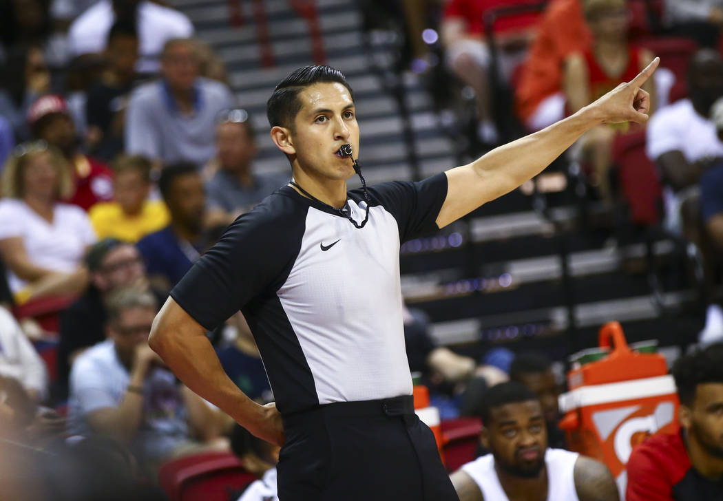 Referee Omar Bermudez motions while officiating a game between Atlanta Hawks and Indiana Pacers ...