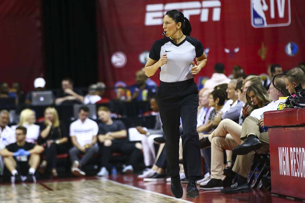 Referee Hortencia Sanchez-Carrizales keeps up with the action while officiating a game between ...