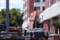 Rescue personnel respond to an explosion that damaged Argenta Hall and Nye Hall on the Universi ...