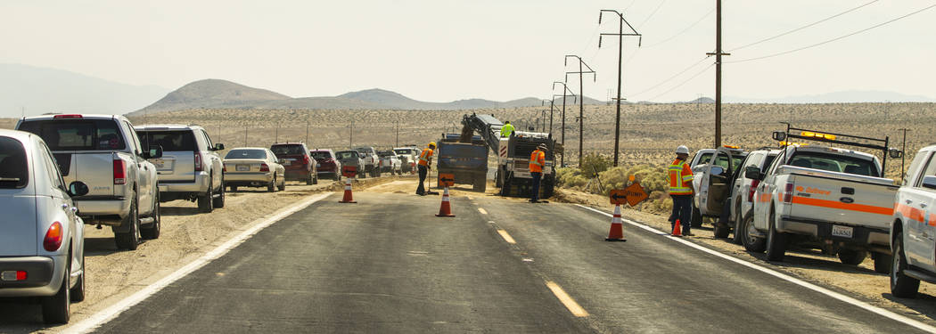 A Caltrans crew continues to repair the extensive cracks which have opened up due to the major ...