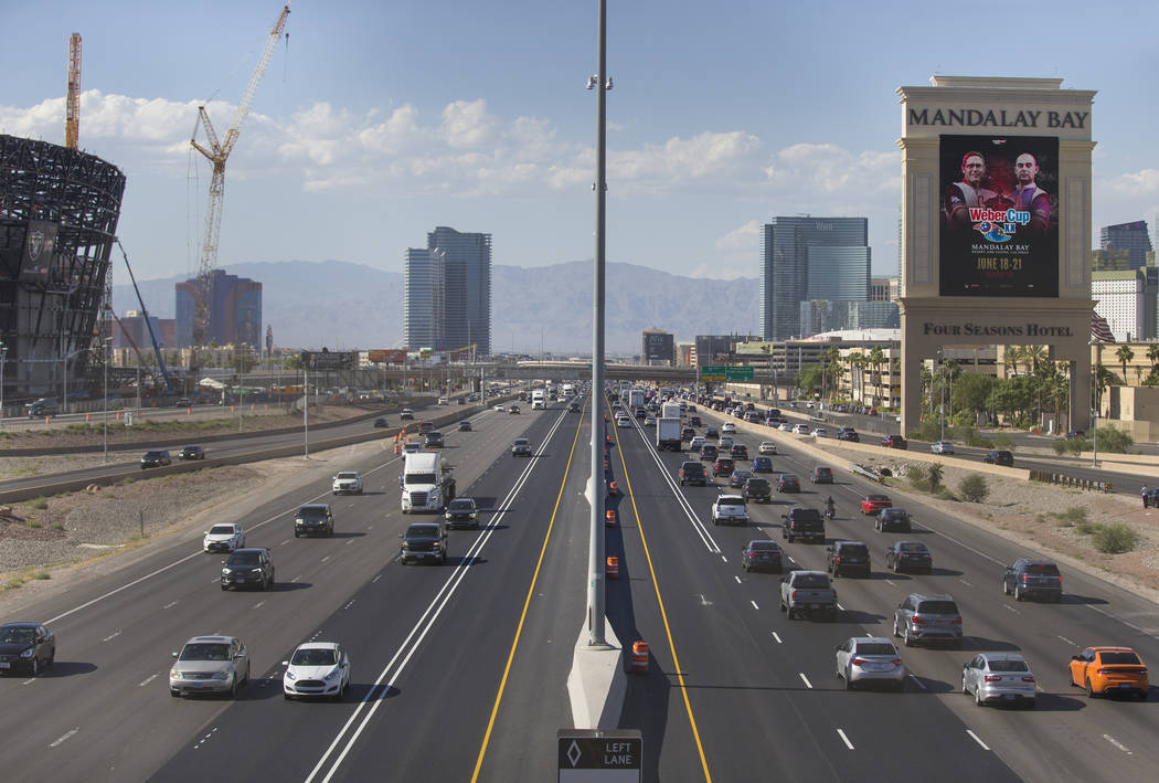 The high occupancy vehicle lanes are largely empty in both directions on Interstate 15 near the ...