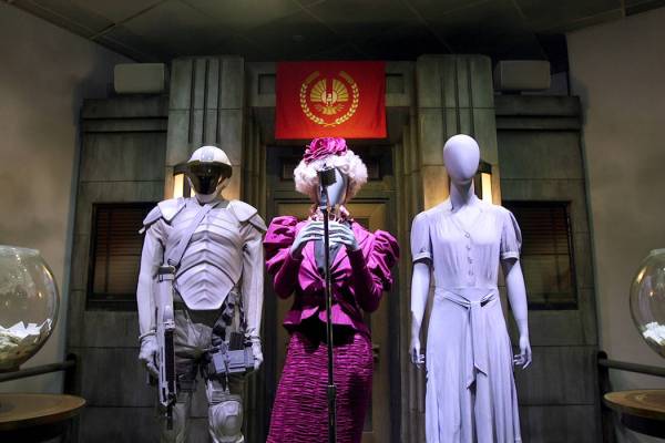 Costumes that were worn by Elizabeth Banks (center), Jennifer Lawrence (right) and other cast o ...