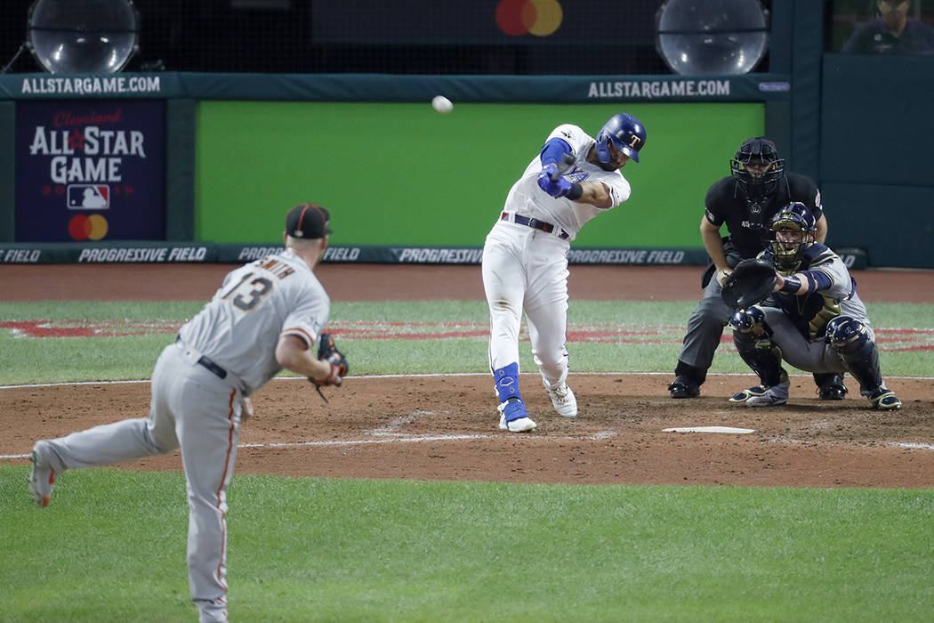 American League's Joey Gallo, of the Texas Rangers, hits a solo home run off National League pi ...