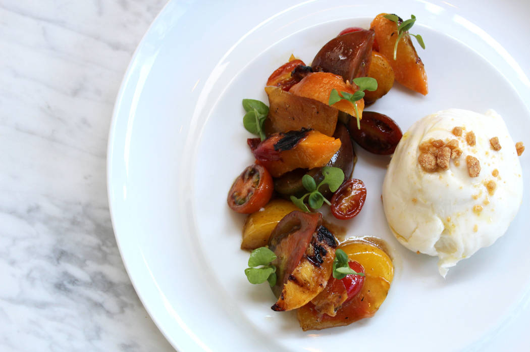 Peach wedges are tossed with chunks of heirloom tomato in a balsamic reduction (Station Casinos)