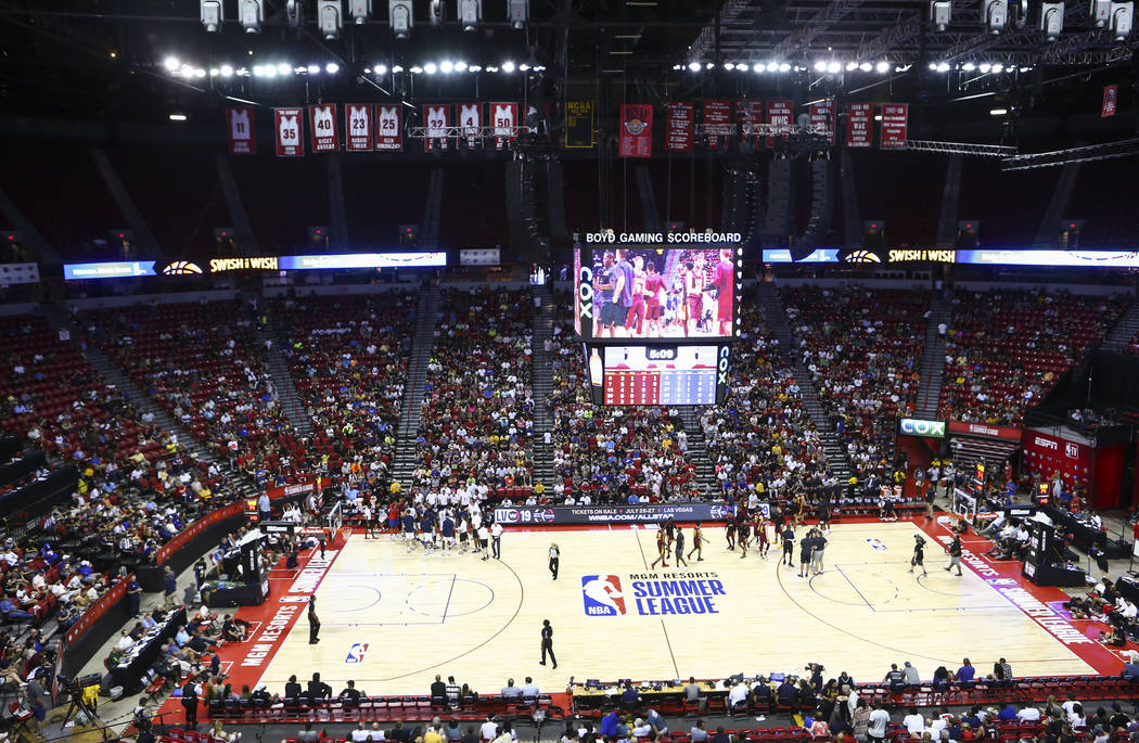 Basketball fans look on during a timeout in a game between the Cleveland Cavaliers and the New ...