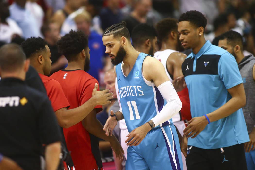 Charlotte Hornets' Cody Martin (11) shakes hands after playing against the Chicago Bulls at the ...