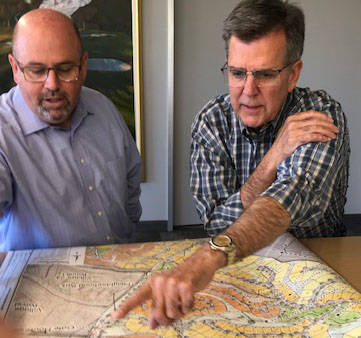 The Howard Hughes Corp. executives Andy Ciarrocchi, left, and Tom Warden view map of properties ...