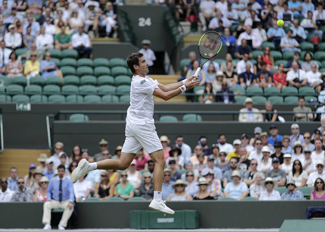 Argentina's Guido Pella returns the ball to Spain's Roberto Bautista Agut during a men's quarte ...