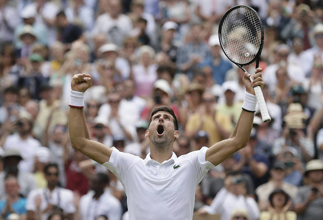 Serbia's Novak Djokovic celebrates defeating Belgium's David Goffin during a men's quarterfinal ...