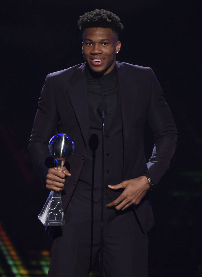 NBA player Giannis Antetokounmpo, of the Milwaukee Bucks, accepts the award for best male athle ...