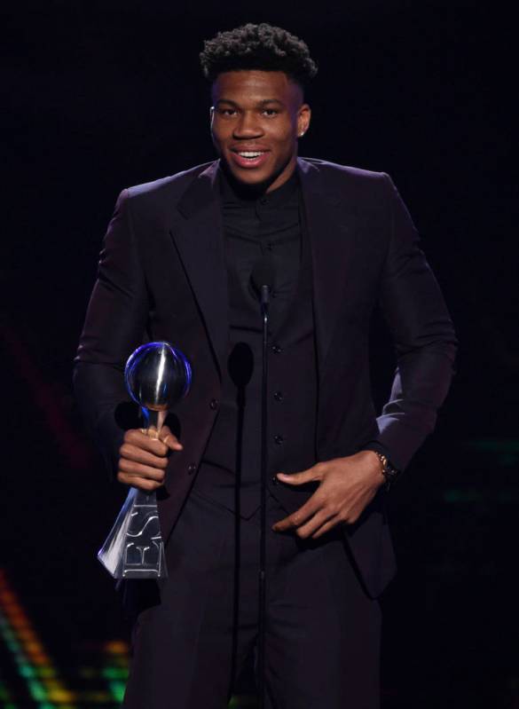 NBA player Giannis Antetokounmpo, of the Milwaukee Bucks, accepts the award for best male athle ...