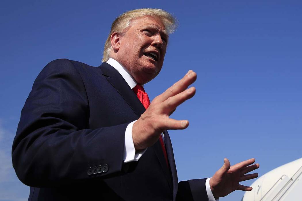 President Donald Trump speaks at Morristown Municipal Airport in Morristown, N.J., on his way r ...