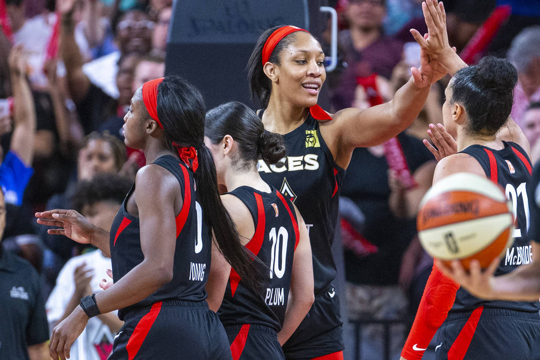 Las Vegas Aces forward A'ja Wilson celebrates a win with teammates after their overtime victory ...