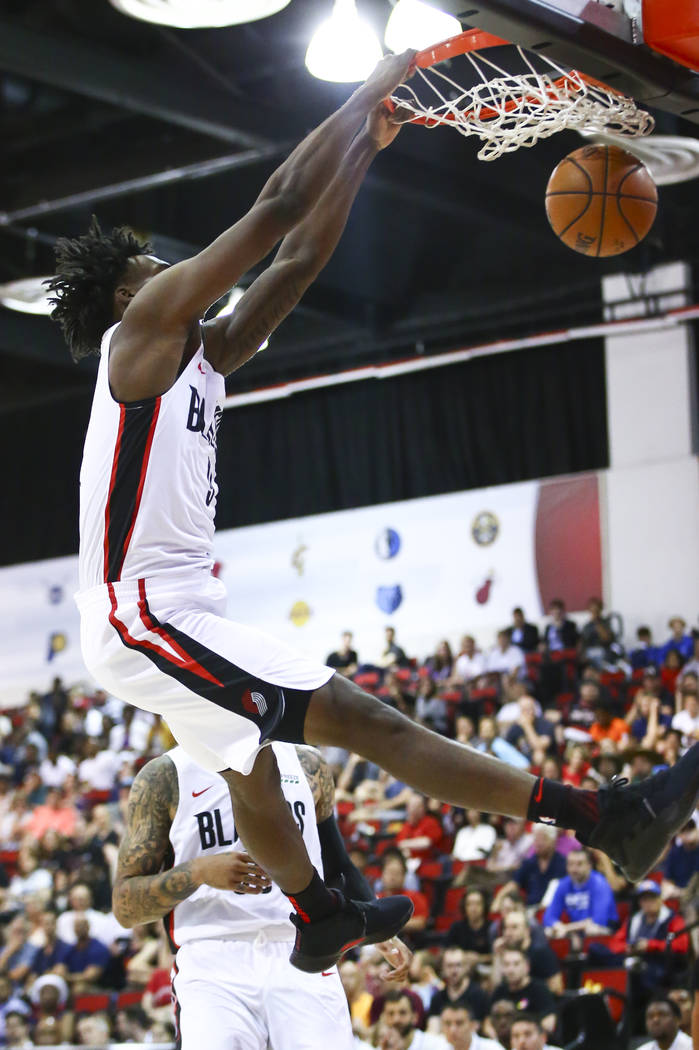 Portland Trail Blazers' Nassir Little (9) dunks against the Houston Rockets during the first ha ...