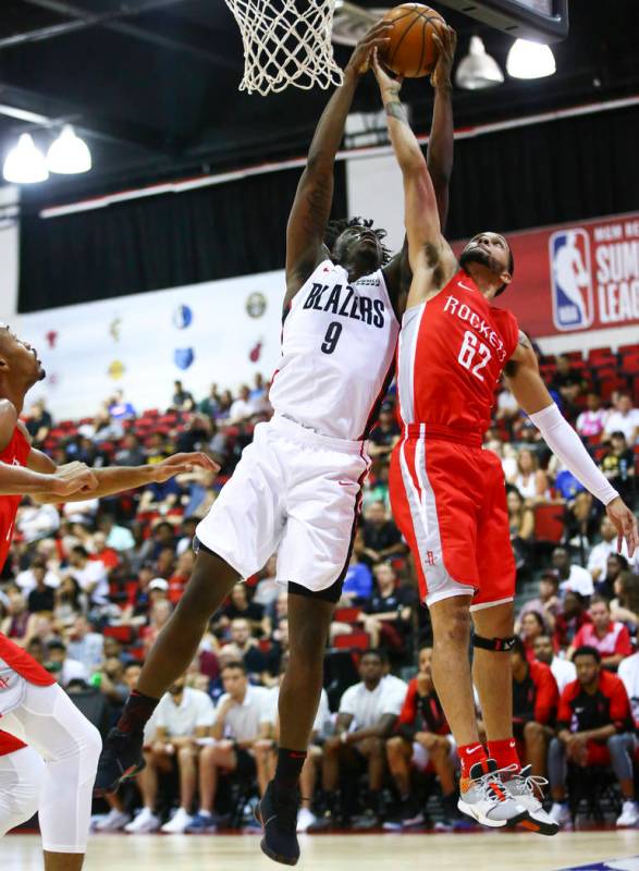 Portland Trail Blazers' Nassir Little (9) battles for a rebound against Houston Rockets' Isaiah ...