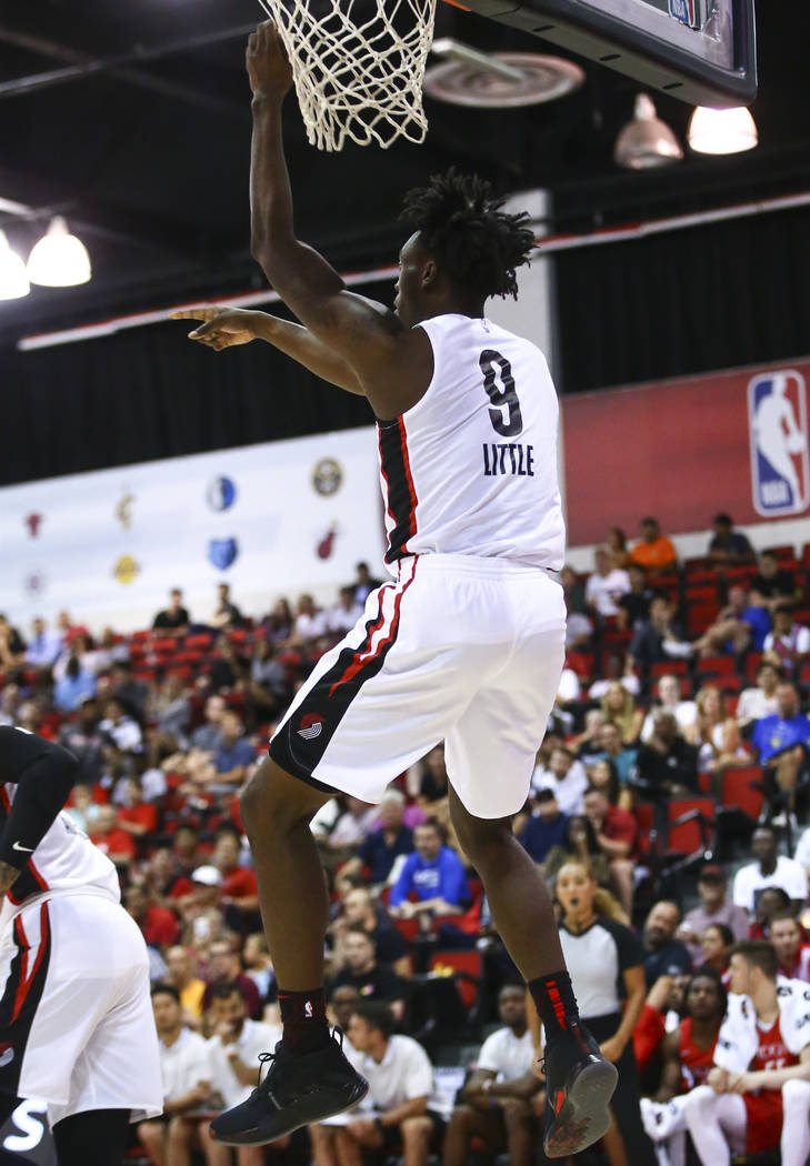Portland Trail Blazers' Nassir Little (9) dunks against the Houston Rockets during the first ha ...