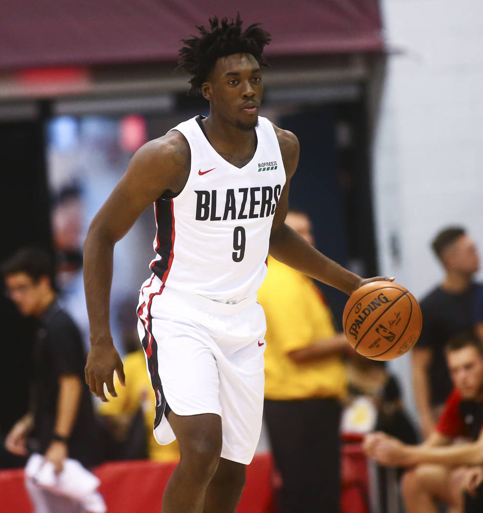 Portland Trail Blazers' Nassir Little (9) brings the ball up court against the Houston Rockets ...