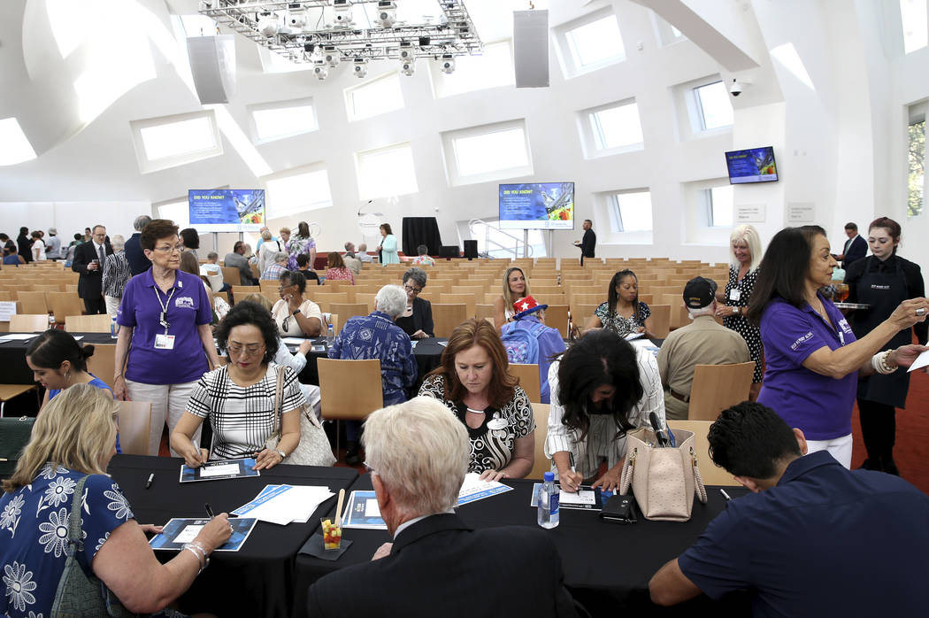 Guests write notes for the time capsule during the 10th anniversary celebration of the Clevelan ...