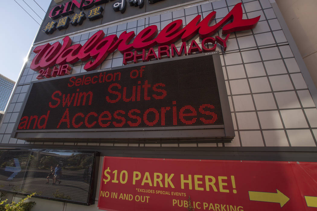 People walk by the Walgreens on the Las Vegas Strip on July 11, 2019 in Las Vegas. (Michael Bla ...