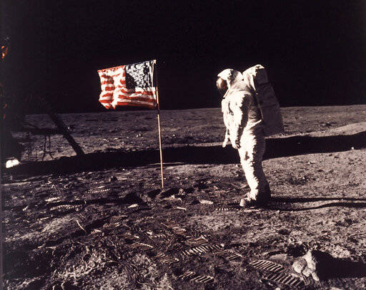 FILE - In this image provided by NASA, astronaut Buzz Aldrin poses for a photograph beside the ...